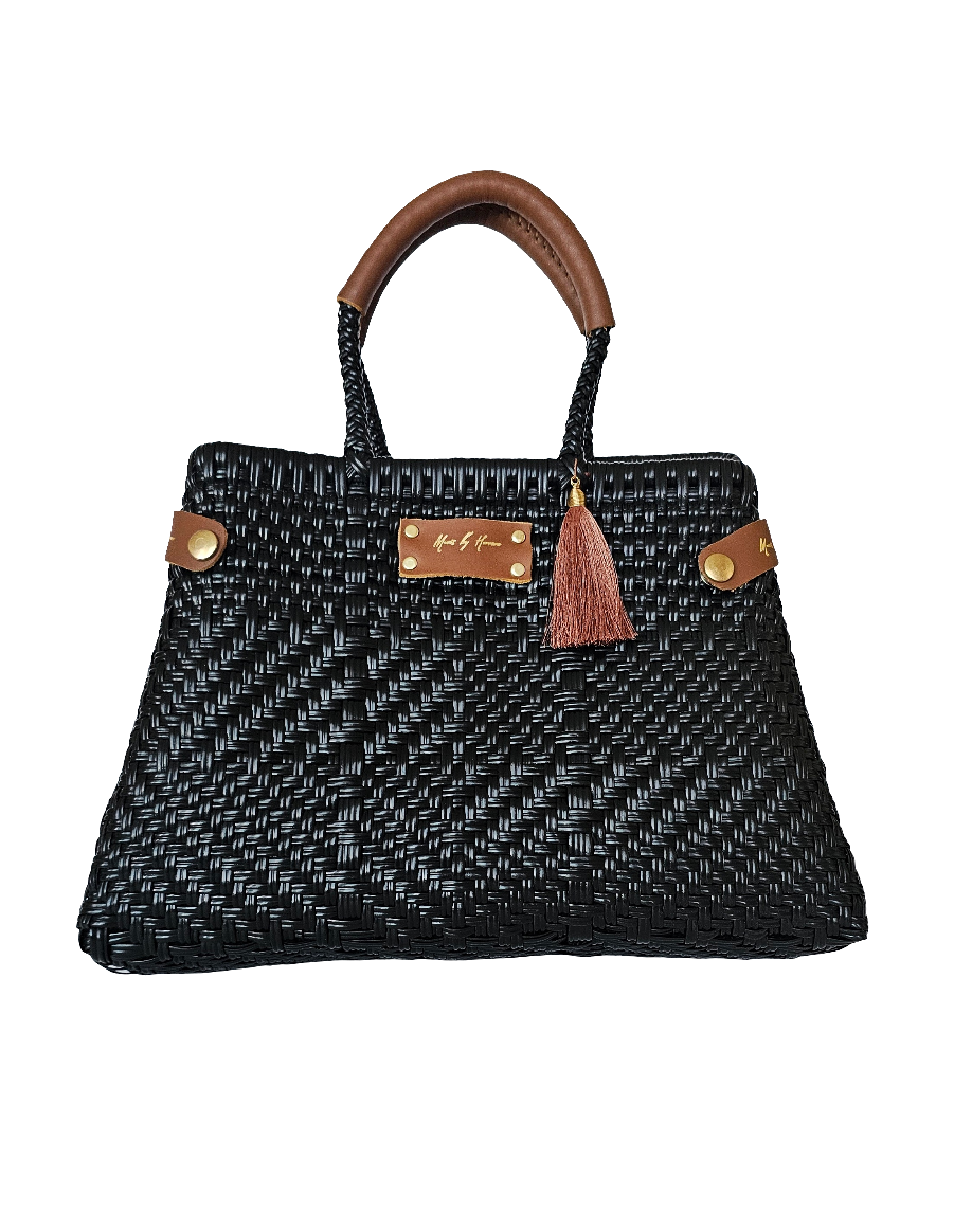 Luxury sustainable handbag made from ethical and recycled plastic and leather.