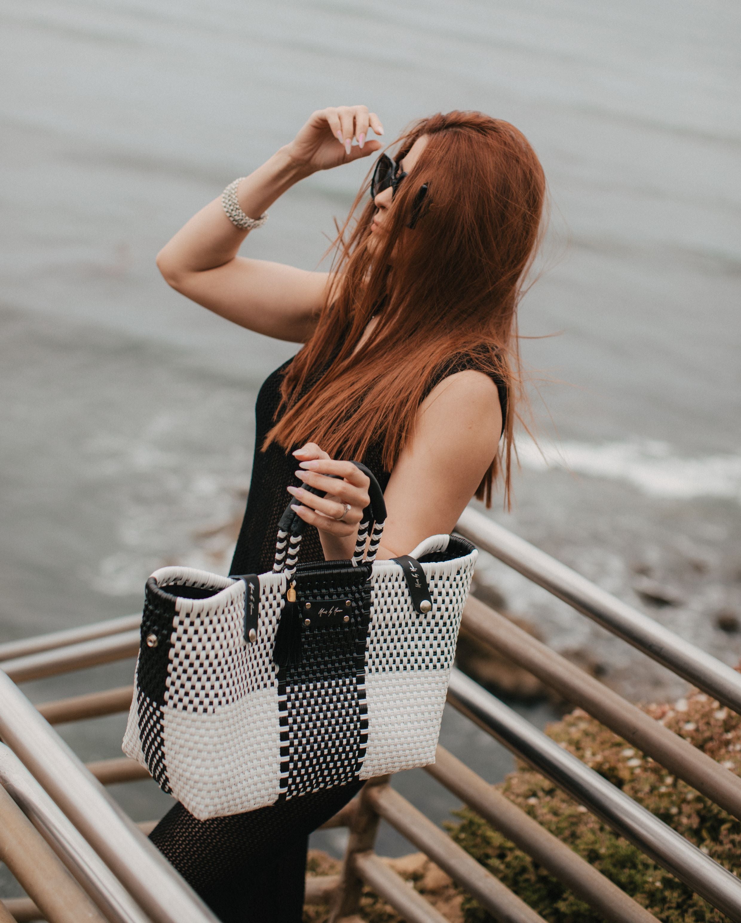 Eco-friendly purse made from upcycled materials in color black and white