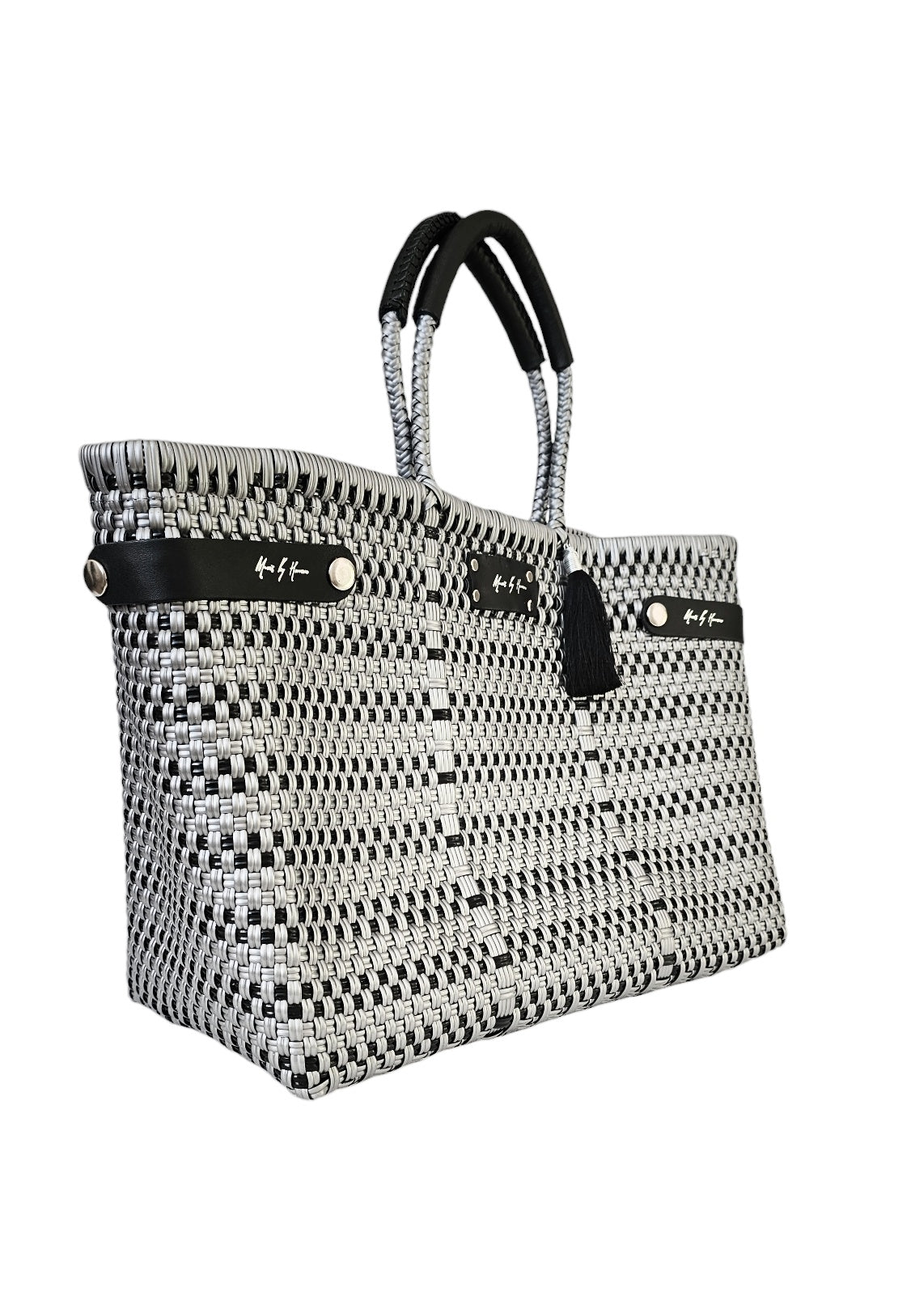 Handcrafted silver and black handbag made from recycled plastic and leather, with a convertible tote design