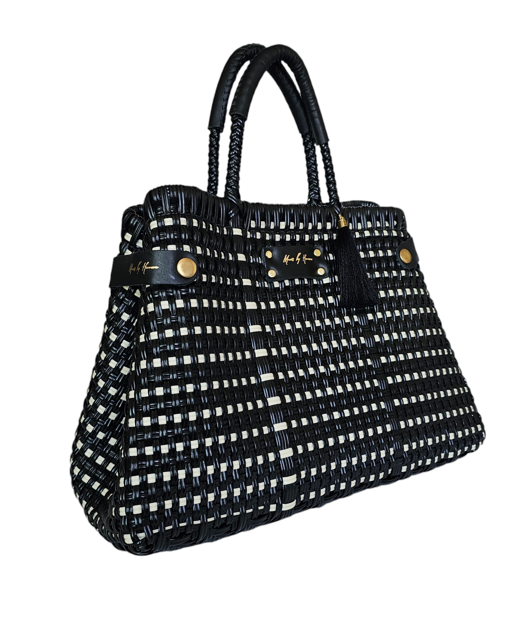 Luxury handwoven handbag that transforms into a tote bag for added versatility in color black with leather handles.