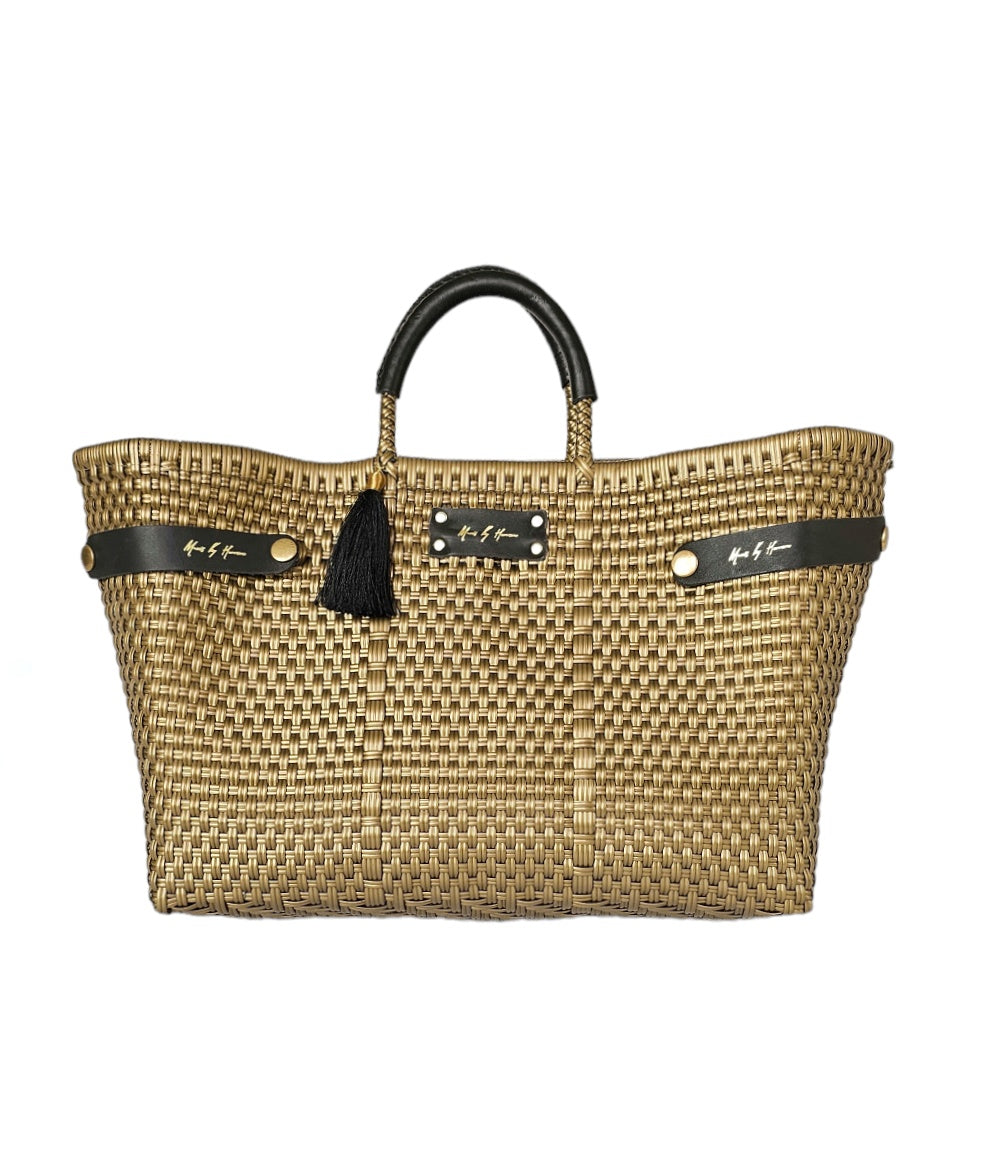 An eco-friendly, sustainable handbag in gold, featuring handles crafted from recycled leather.